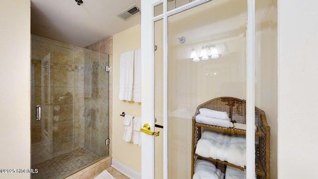 Primary Bathroom with enclosed glass shower angle view | Image 30