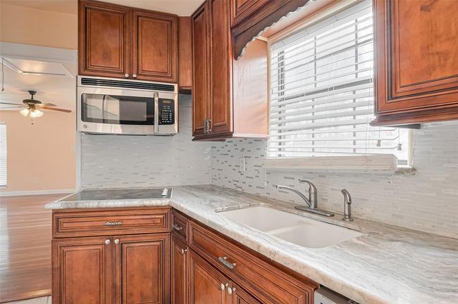 Secondary kitchen space is great for family game night, or in law suite. | Image 44