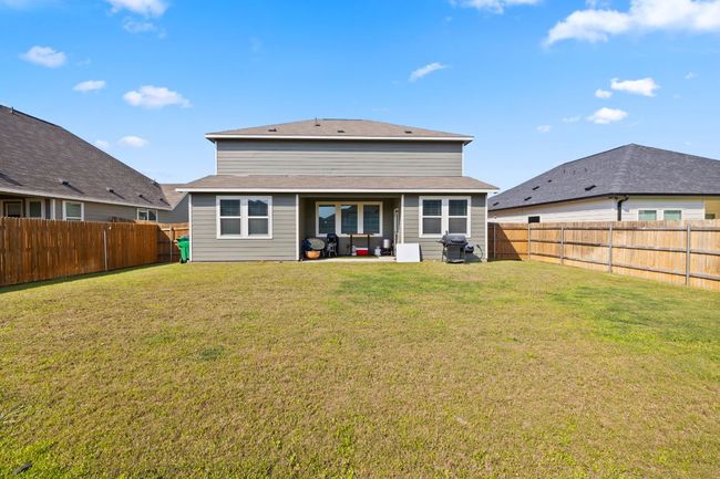 Back of property featuring a lawn, a patio, and a fenced backyard | Image 26