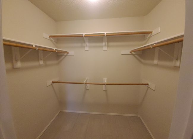 View of main walk in closet | Image 19