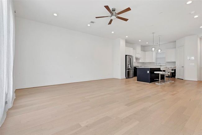 Additional photo of the family room that the kitchen seamlessly opened . | Image 9