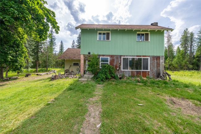 View of front of property with a front yard and a chimney | Image 48