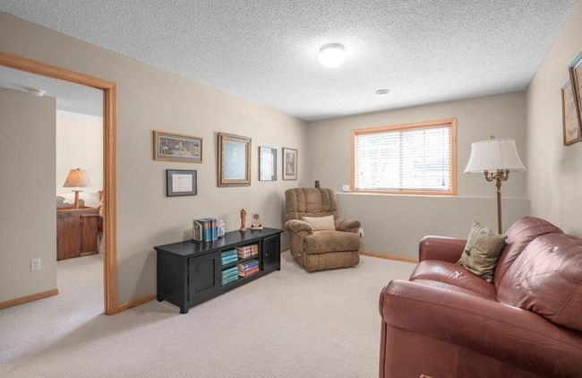 Next to the living room is an additional bedroom and full bathroom. | Image 17
