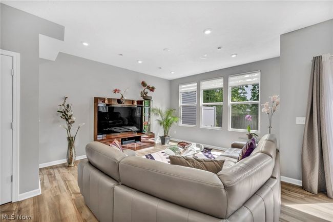 Living room featuring light wood-type flooring | Image 10