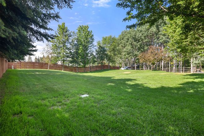 View of fenced yard | Image 45