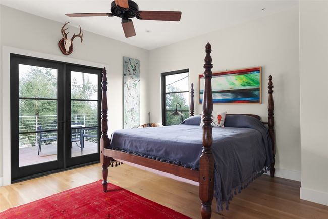 Bedroom featuring multiple windows, access to large balcony and bedroom wired for sound | Image 23
