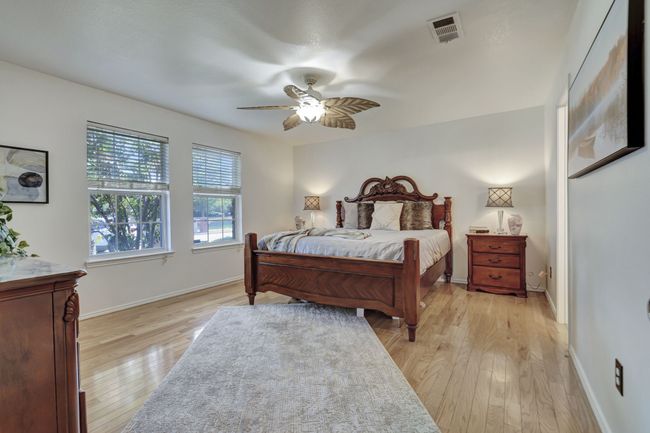 Bedroom featuring ceiling fan and light hardwood / wood-style floors | Image 21