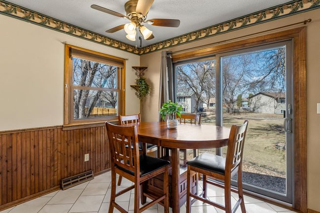 A sliding door provides direct outdoor access, offering potential for a future deck addition to expand entertainment options. | Image 9