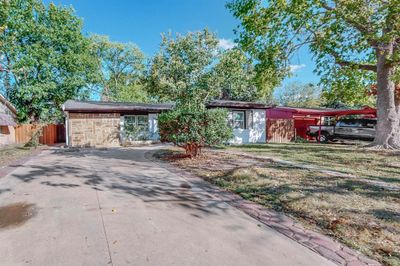 Ranch-style home featuring a front lawn | Image 1