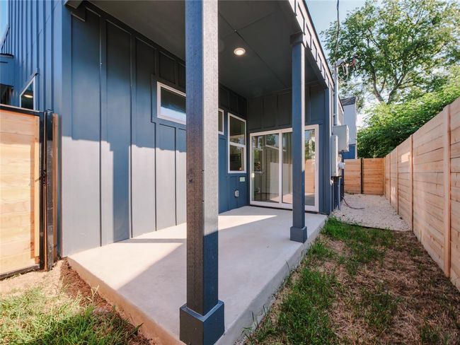 Fenced backyard with a patio | Image 5