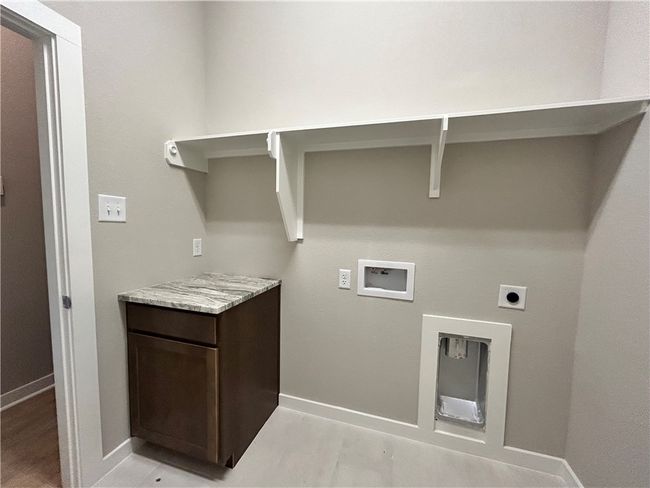 Laundry area with connections/ storage | Image 16