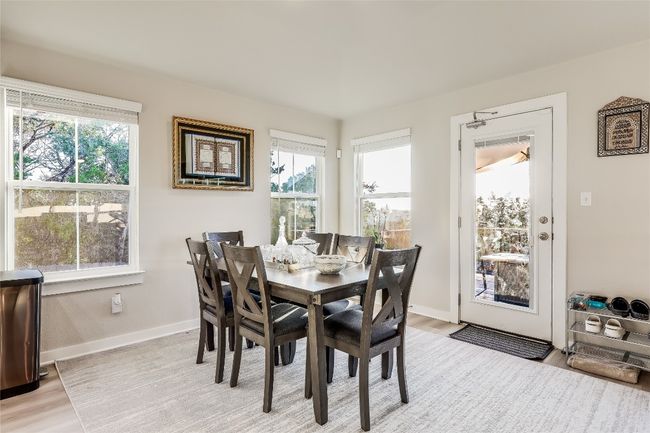 Dining space with light wood-type flooring and baseboards | Image 13