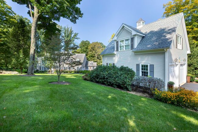 Detached 2 car garage with unfinished second floor that seamlessly ties to the home and property. | Image 39