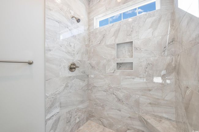 Bathroom with a tile shower | Image 19