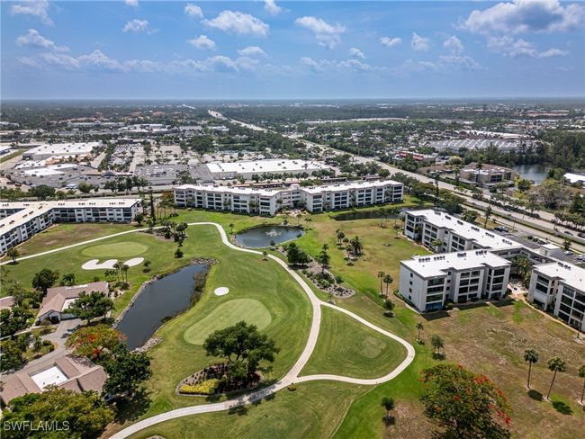 Aerial view of apartment complex / building and a nearby body of water | Image 33
