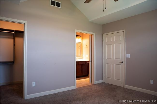 Guest bedroom opens to custom closet & pocket door to full bath | Image 5