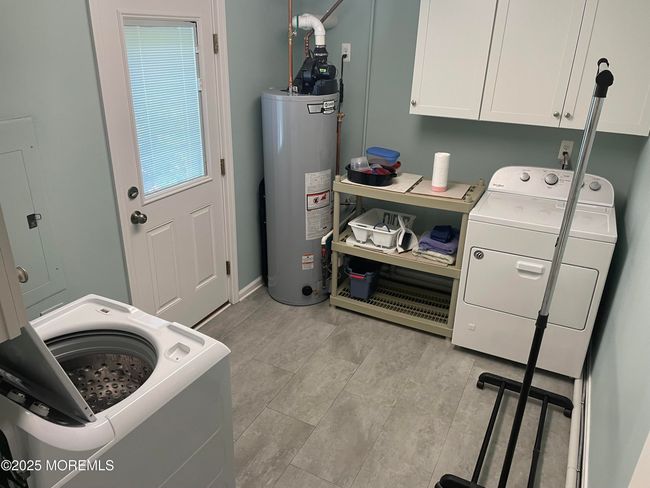 Laundry room with door to back yard , and outdoor shower | Image 15