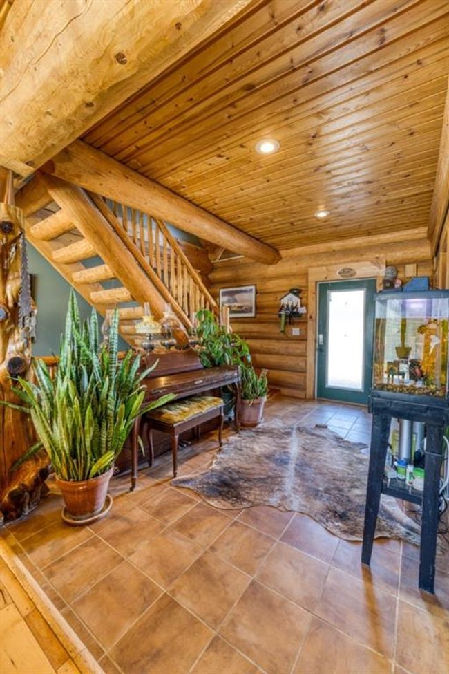 Foyer with log walls, recessed lighting, stairs, wooden ceiling, and tile patterned floors | Image 18