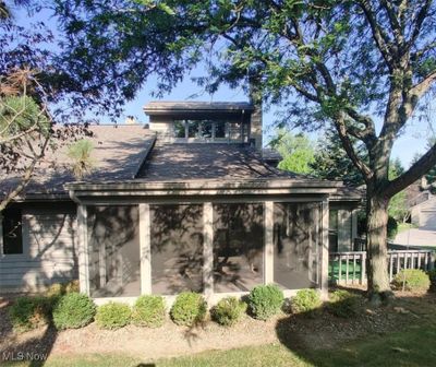 Back of property with an enclosed porch | Image 2