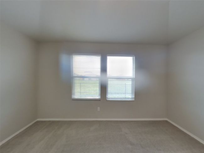 Spare room featuring baseboards and light colored carpet | Image 6