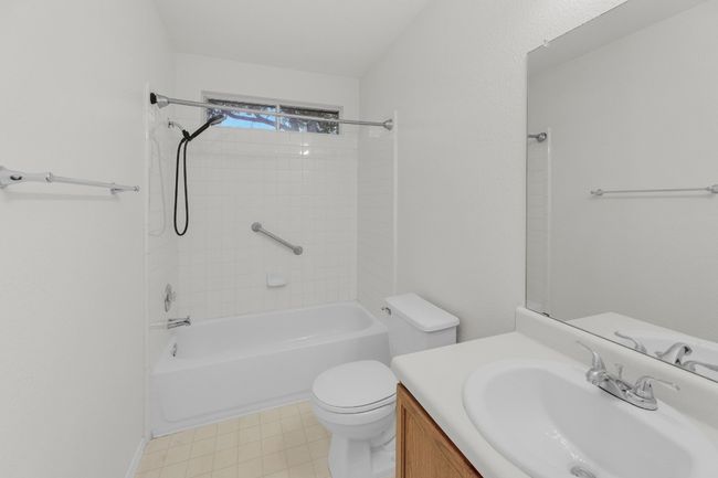 Full bathroom featuring vanity, shower combination, and toilet | Image 27