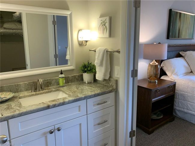 Bathroom featuring vanity and a walk in closet | Image 13