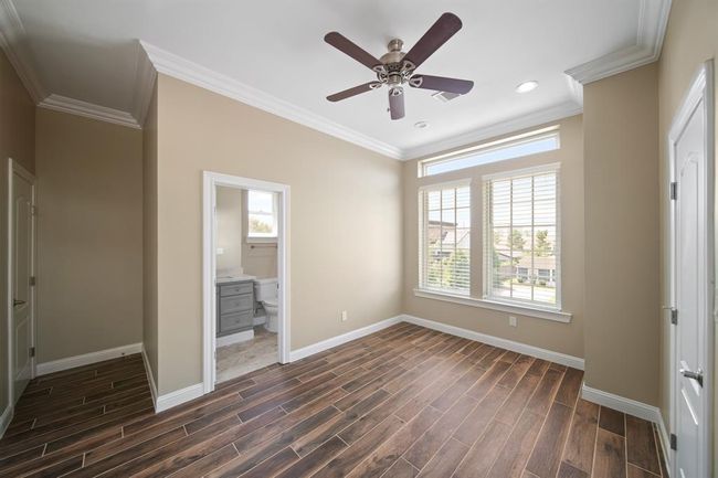 Each guest bedroom features an en-suite bathroom and walk-in closet with built-in shelving. | Image 26