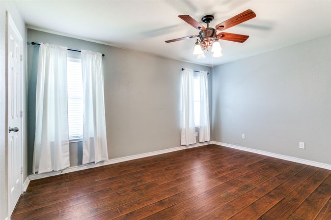 The second bedroom is oversized, offering flexible use for guests, a home office, or playroom. | Image 24