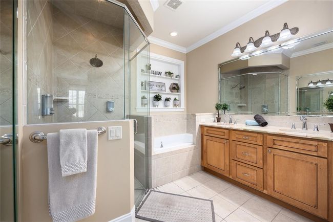 Primary En Suite Bathroom with dual sinks, large soaking tub, and walk-in shower. | Image 18