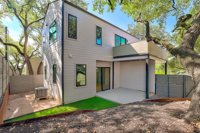 Back of house with a patio area, a fenced backyard, and central air condition unit | Image 32