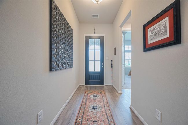 Inviting foyer with Jack-and-Jill rooms and bathroom to the left of entry. | Image 7