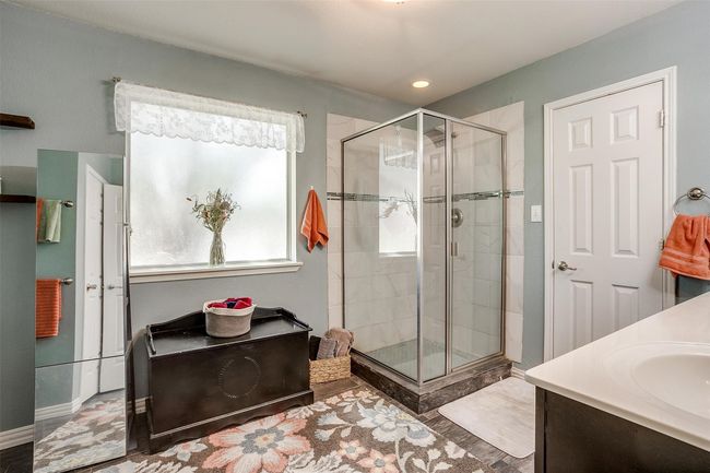 Bathroom featuring a shower stall, vanity, baseboards, and recessed lighting | Image 26