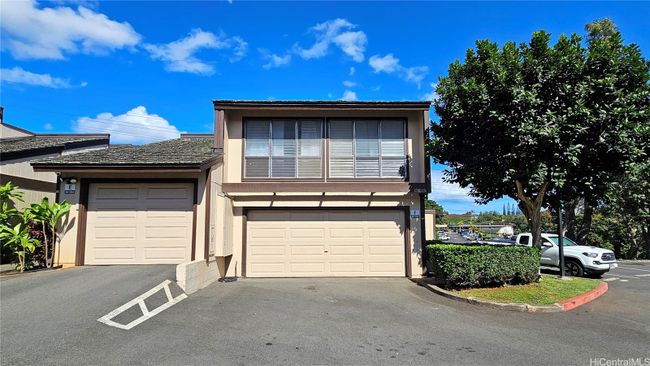 Corner unit with enclosed front lanai and two-car garage. | Image 1