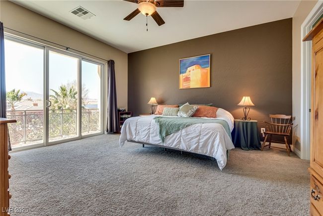 Bedroom featuring carpet, access to outside, ceiling fan, and visible vents | Image 51