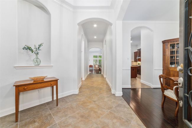 As you enter, you are greeted by tall ceilings, neutral paint and an updated look. | Image 5