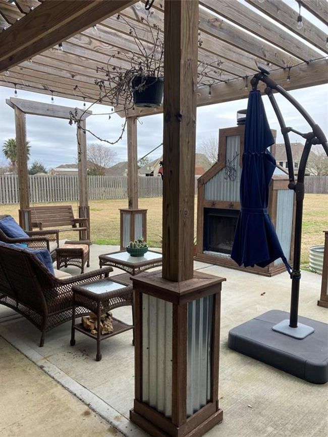 Another view of the outdoor fireplace | Image 36