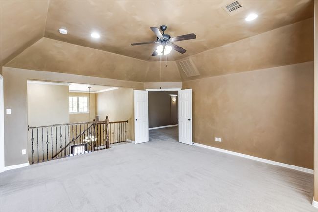 Additional living space with baseboards, carpet, lofted ceiling, and ceiling fan | Image 27