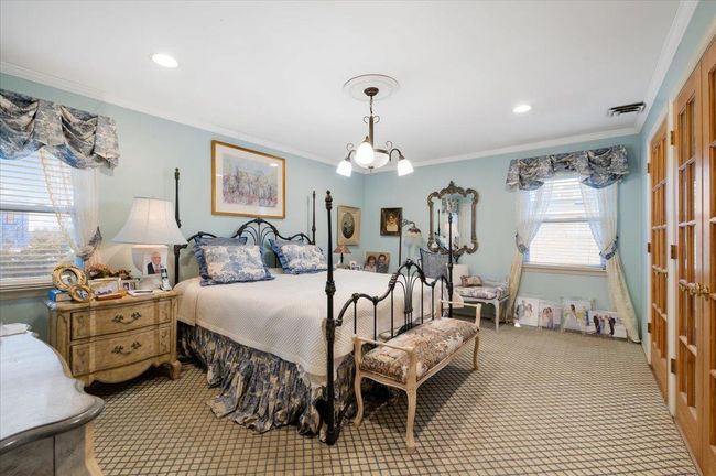 Bedroom with an inviting chandelier, carpet floors, recessed lighting, visible vents, and ornamental molding | Image 13
