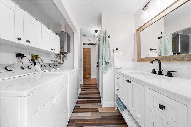 Main Home - Guest Bathroom also has the washer and dryer and tankless water heater. | Image 43