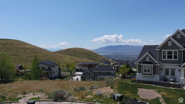 View of mountain backdrop with nearby suburban area | Image 8
