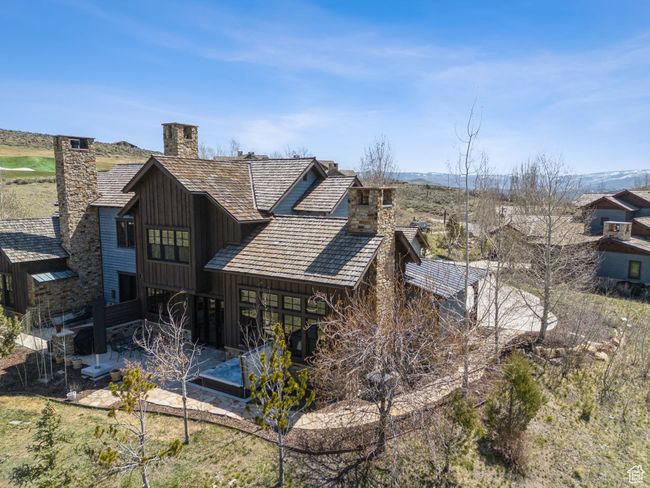 Back of property with a chimney and a patio area | Image 40