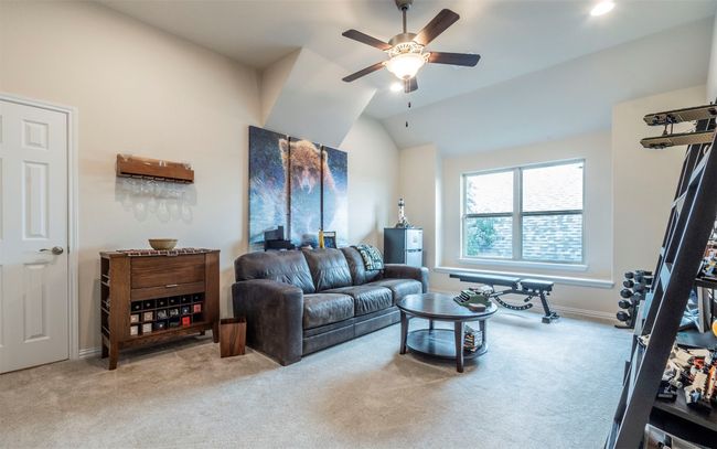 The upstairs (second) living room could make an excellent media room, play area, guest area, or a workout space. The possibilities are endless! It also features its own full bathroom. | Image 15