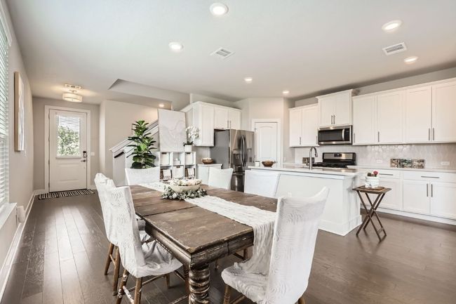 Dining space with wood finished floors and recessed lighting | Image 10