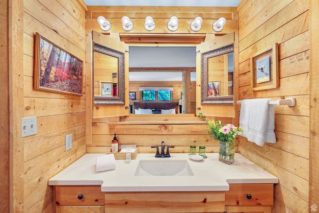 Bathroom with wood walls and vanity | Image 51