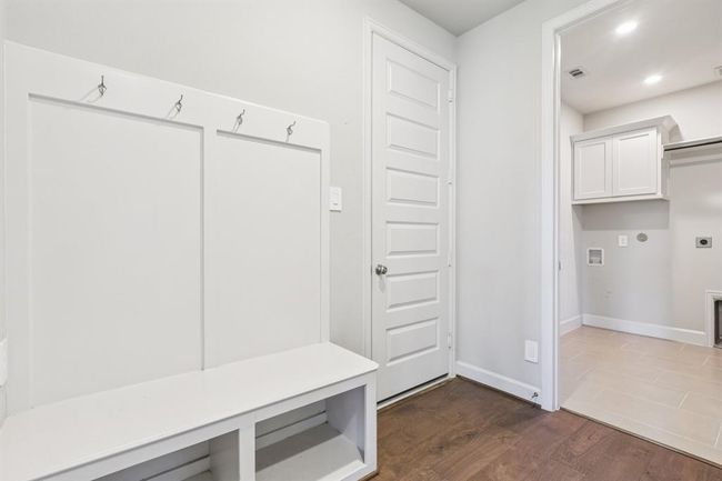 Built-in hooks and storage make this the perfect space to drop bags and shoes as you enter from the garage | Image 17