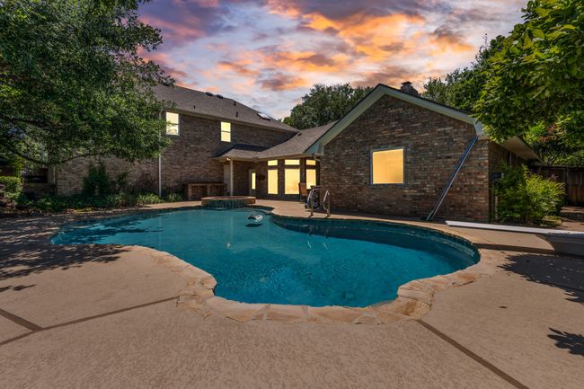 View of swimming pool with connected hot tub | Image 30