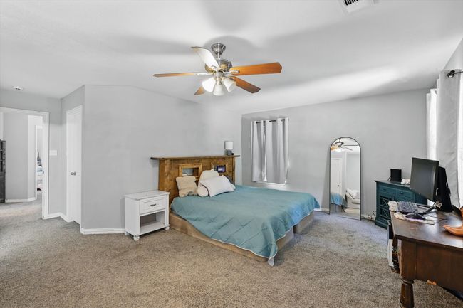 Bedroom with carpet flooring and a ceiling fan | Image 18