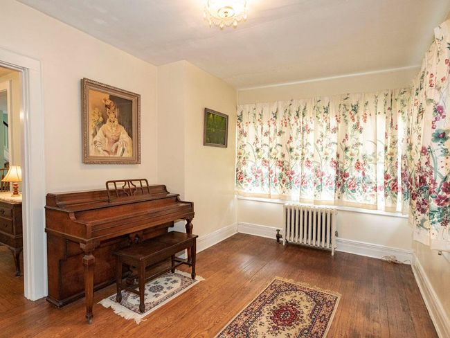 Sitting room with radiator heating unit and hardwood / wood-style flooring | Image 19