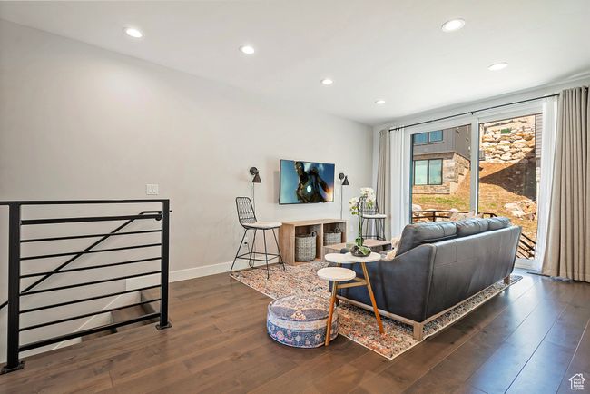 Living area with baseboards, wood finished floors, and recessed lighting | Image 31