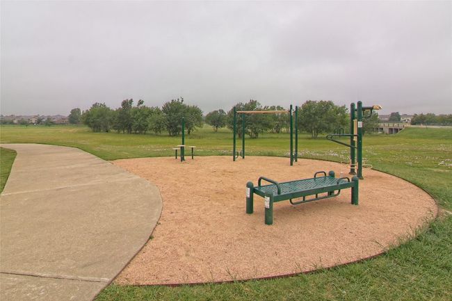 View of home's community with a lawn | Image 37